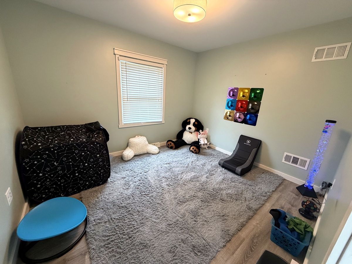 Sensory room with a soft rug and plush toy